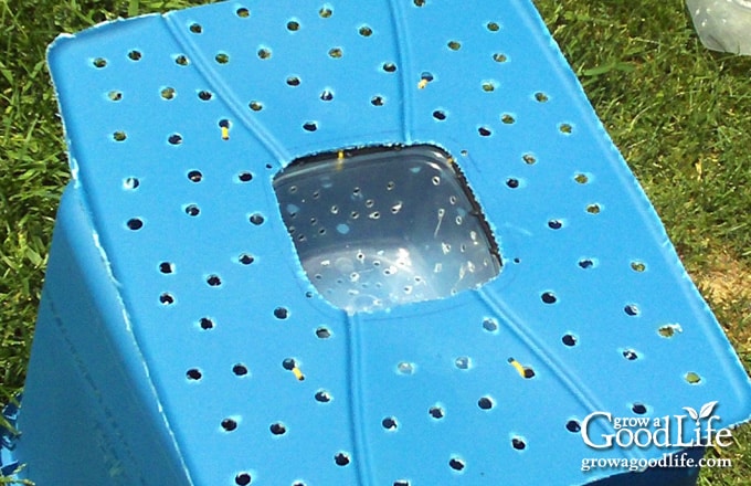 Plastic wicking basket attached to the aeration shelf with zip ties.