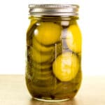 jar of zucchini pickles on a table