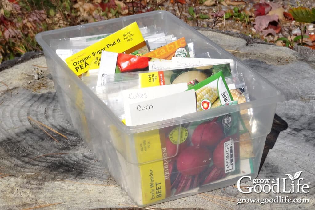Shoe box tote filled with organized garden seeds.