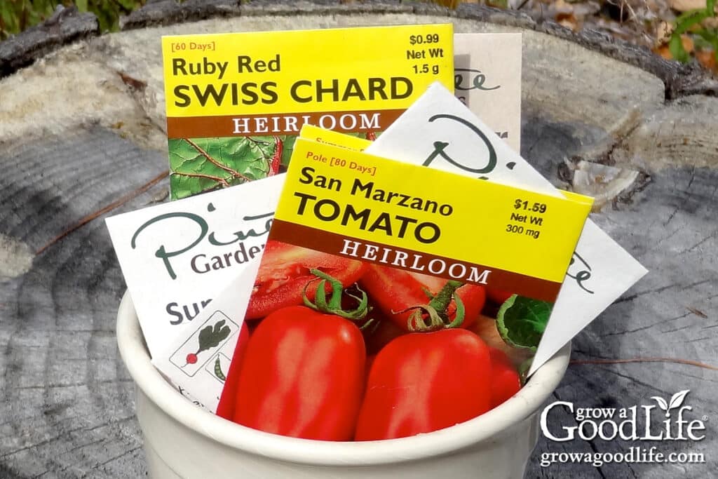 Overhead view of a plant pot filled with colorful seed packages.