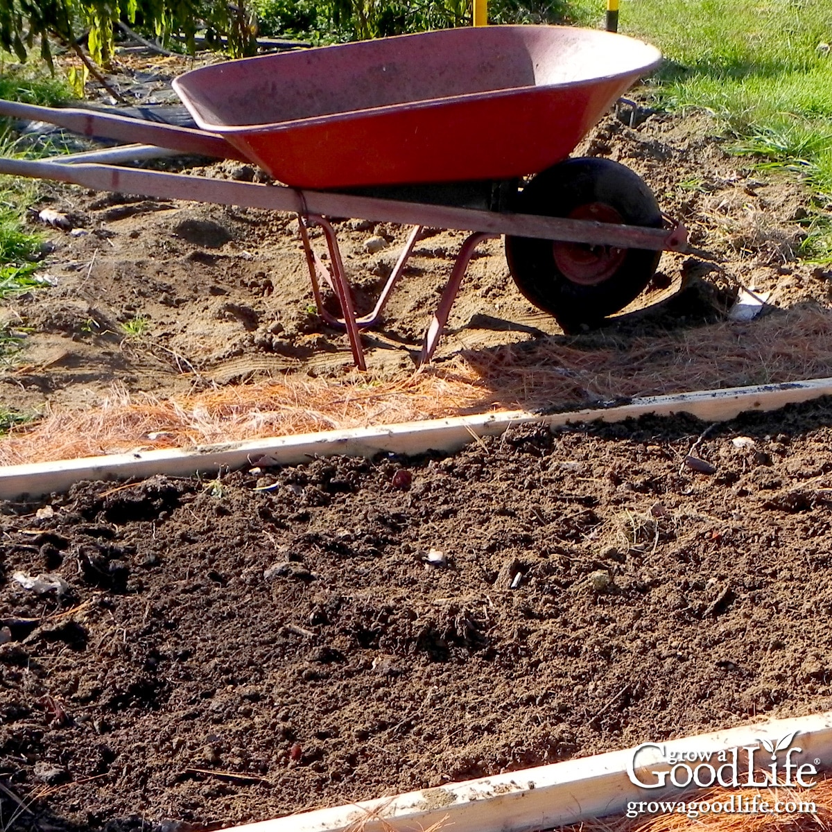 Raised garden bed cleaned and refreshed with compost.