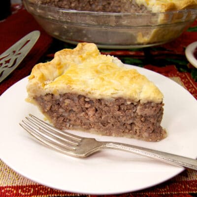 slice of meat pie on a white plate
