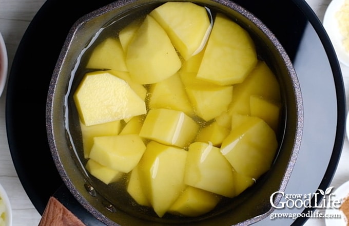 peeled and cut potatoes in a pot
