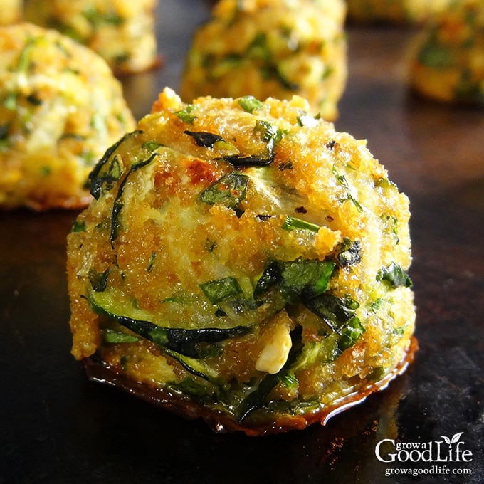 close up of a zucchini ball on a baking sheet