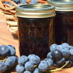 jars of grape jelly on a table