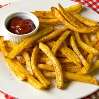 Yes, you can make crispy seasoned baked French fries at home without deep-frying in vegetable oil. Instead, make your own hand cut homemade baked fries!