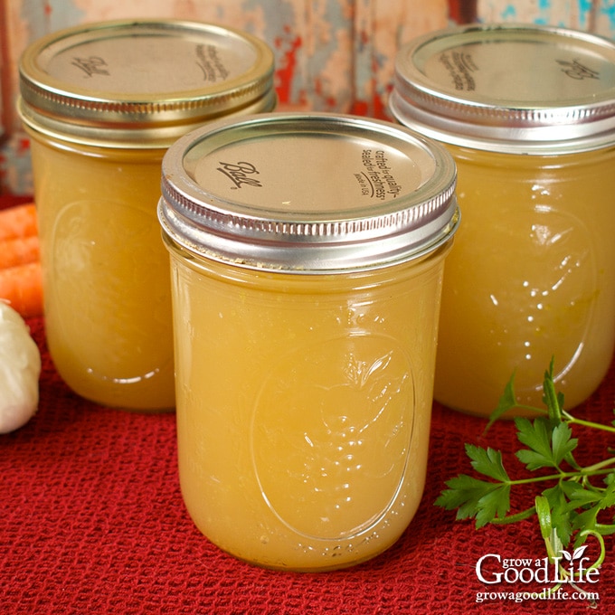 jars of home canned turkey stock on a table