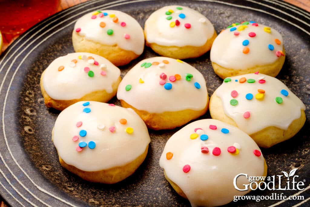 Close up of a plate of Italian anise cookies with pastel sprinkles for Easter.