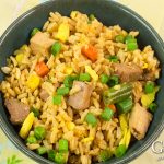 Fried rice is a great recipe to have on hand to re-purpose leftovers so they don't go to waste. This pork fried rice recipe combines leftover pork, rice, and vegetables with a tasty ginger garlic sauce for a dish that will satisfy your craving for takeout.