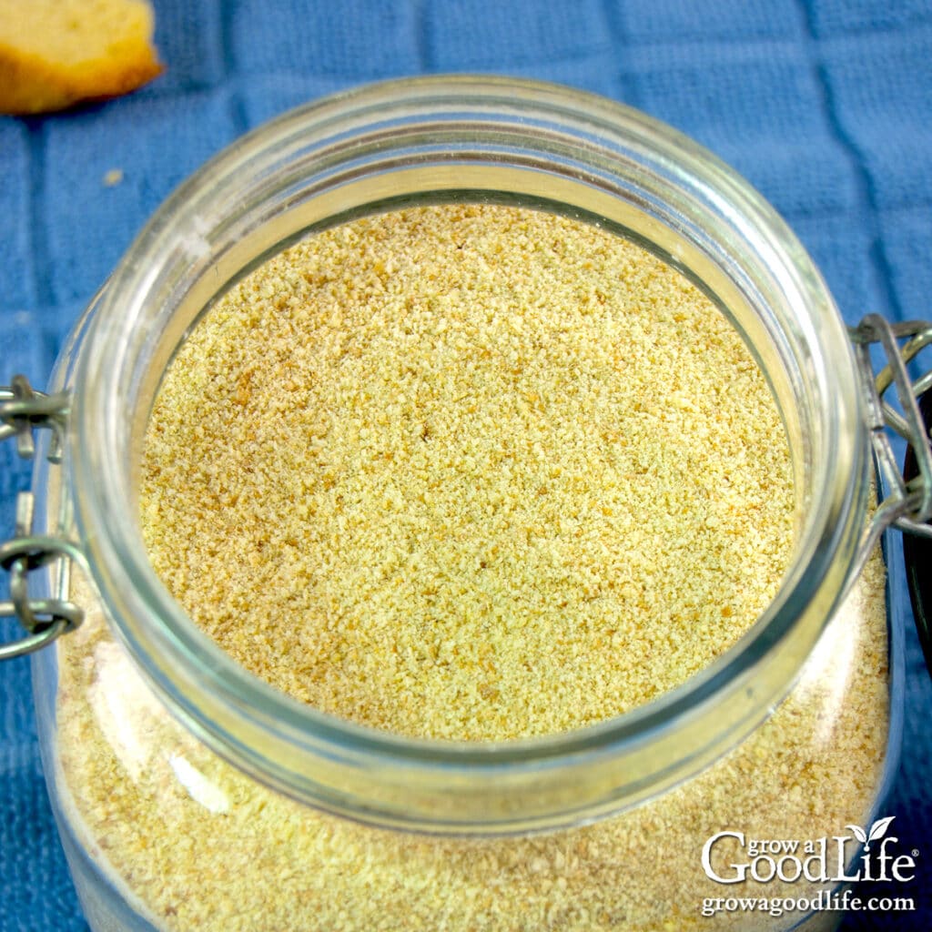 Close up of homemade dried bread crumbs in an open jar.