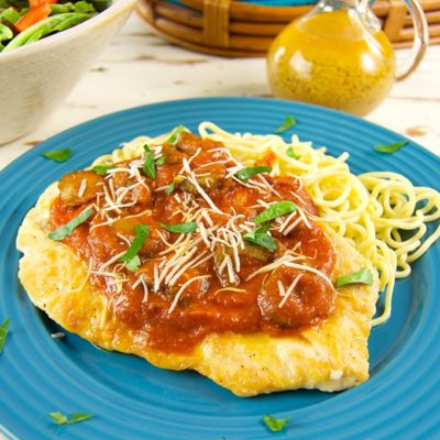 This chicken paillard dish is quick and easy to prepare at home. Thinly pounded, seasoned, and browned chicken cutlets smothered in a mushroom marinara sauce.