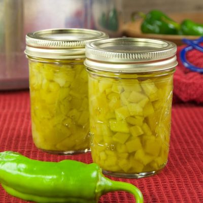 Whether you have a bumper crop in your garden or decided to buy in bulk, roasting and pressure canning chile peppers is a great way to preserve them.