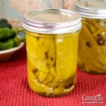 jars of home canned green chile peppers on a table
