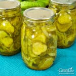 jars of bread and butter pickles on a table