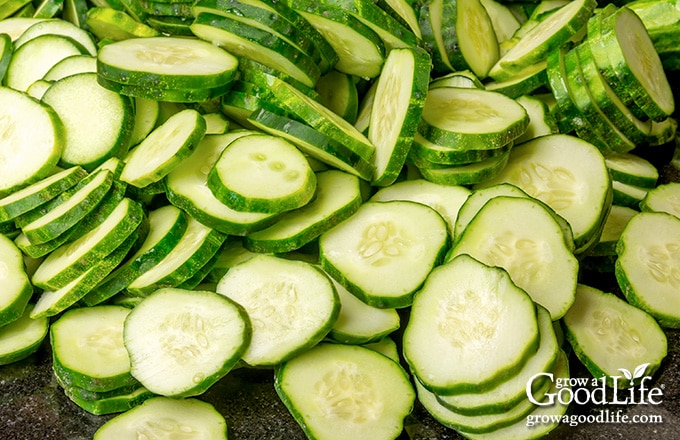a pile of sliced cucumbers on a cutting board