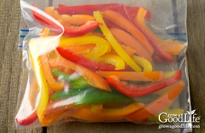 closeup of a freezer bag filled with color bell pepper strips