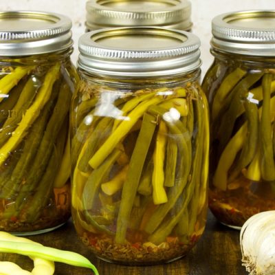 Old-fashioned Dilly Beans are zesty pickled string beans simply flavored with dill, garlic, and spicy pepper flakes.