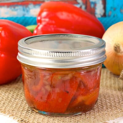 jar of roasted red peppers on a table