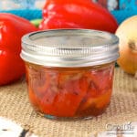 jar of roasted red peppers on a table