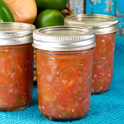 jars of salsa on a blue towel