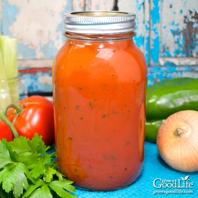 quart jar of home canned tomato vegetable juice on a table