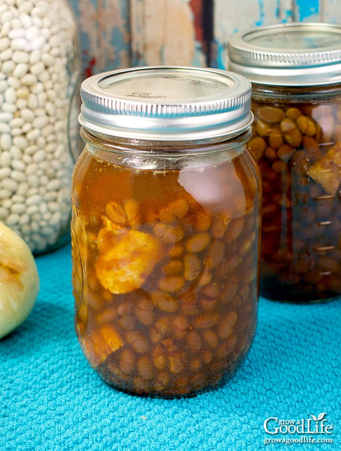 jars of canned Boston baked beans on a blue towel