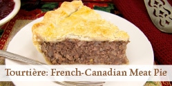 A piece of tourtiere on a white plate with text overlay that reads Tourtière French-Canadian Meat Pie Recipe.