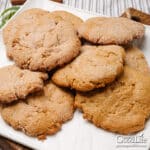 Freshly baked gingersnap cookies on a plate.
