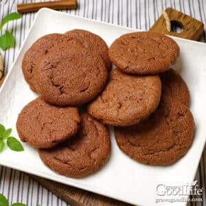 Freshly baked gingersnap cookies on a plate.