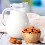 almond milk in a glass pitcher on a table