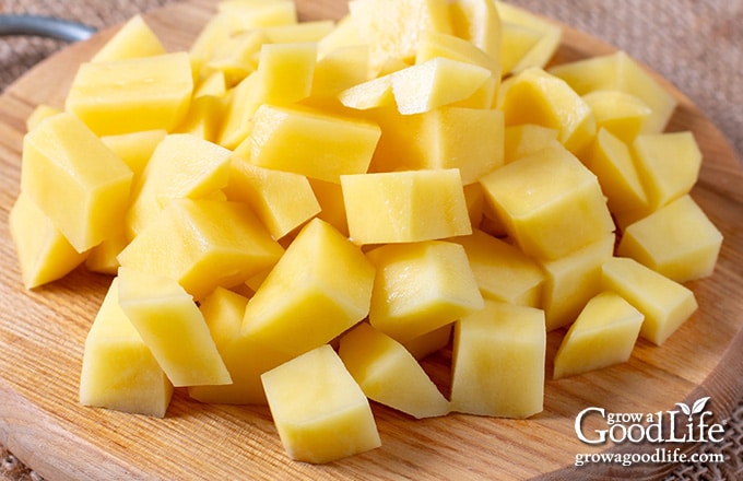 cubed potatoes on a cutting board