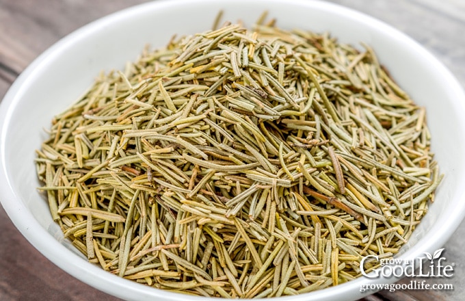 dried rosemary in a white bowl