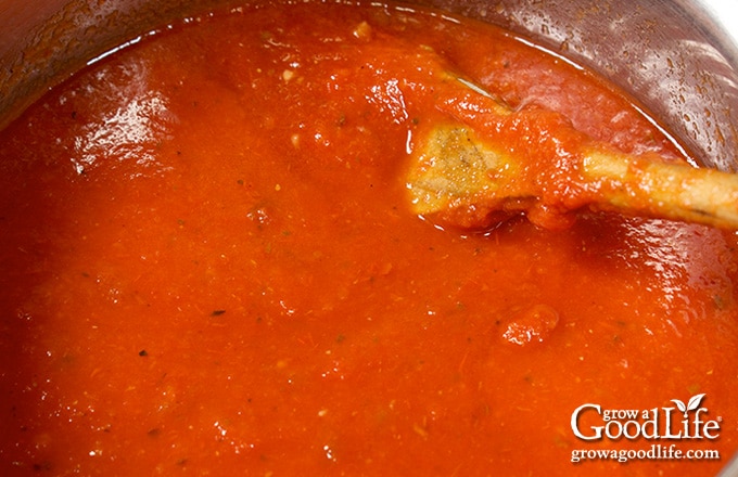 Close up of thickened spaghetti sauce in a pot after simmering.
