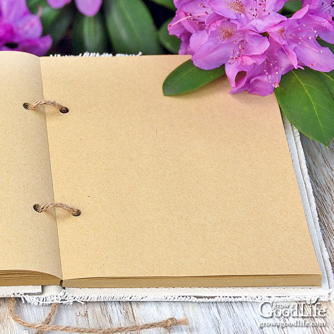 A blank garden journal on a table.