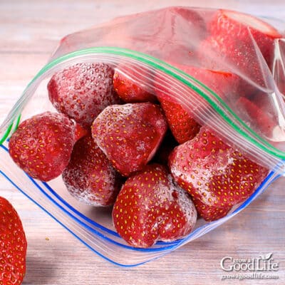 Frozen strawberries in a freezer bag.