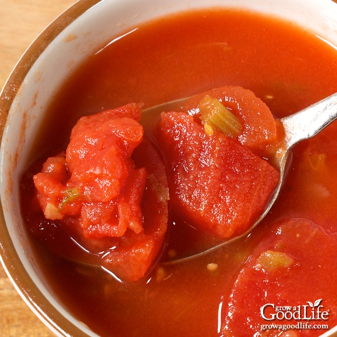 Overhead view of stewed tomatoes in a bowl.