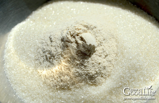 Over head image of sugar and pectin in a bowl.