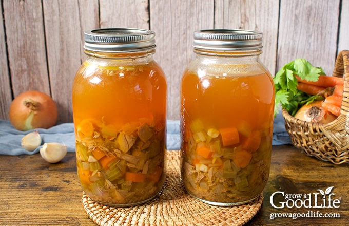 Two quart sized canning jars of home canned turkey soup.