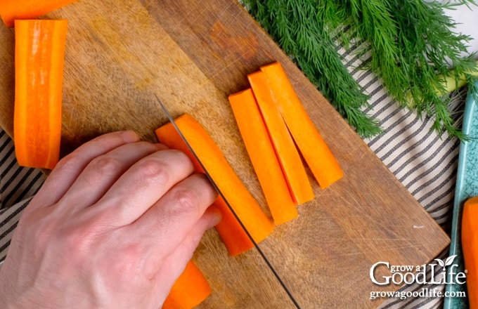 Cutting carrots into sticks.