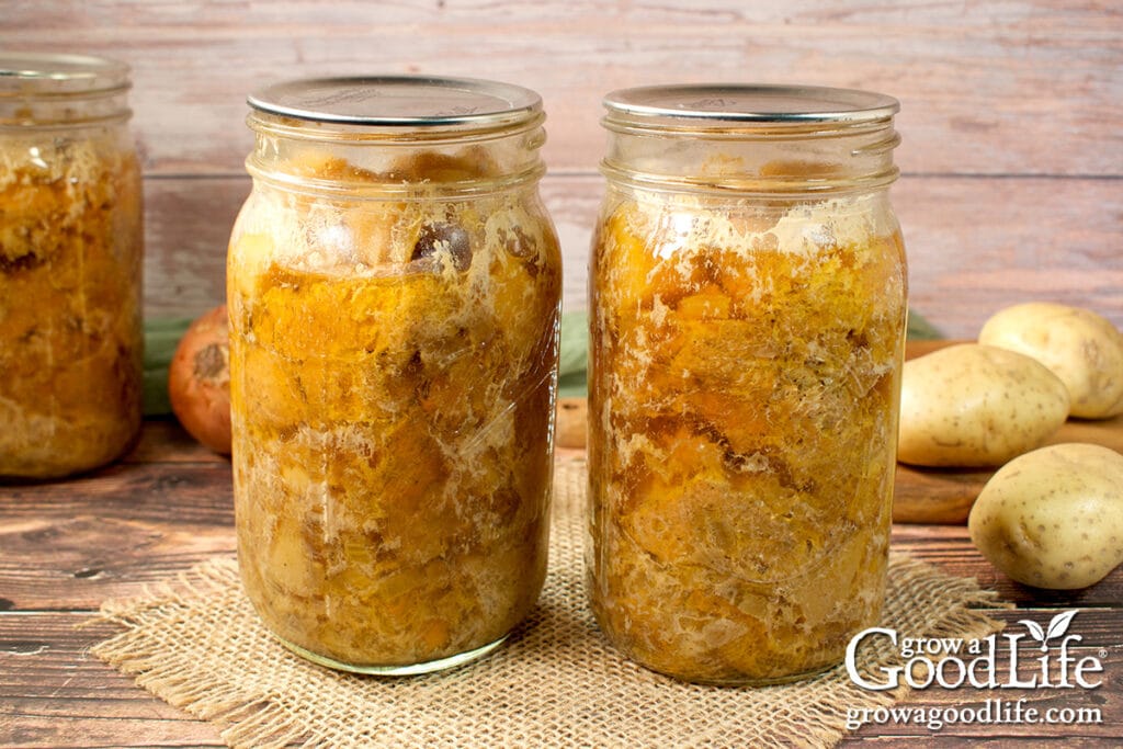 Two quart jars of home-canned chicken and gravy.
