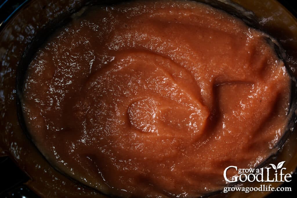 Overhead view of apple butter in a slow cooker crock.