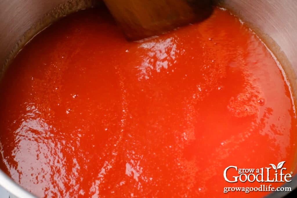 Re-heating the tomato juice before filling the jars.