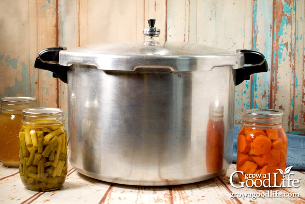 Presto 16-quart pressure canner on a table.