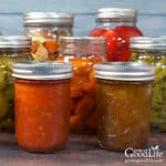 Jars of home canned food on a table.