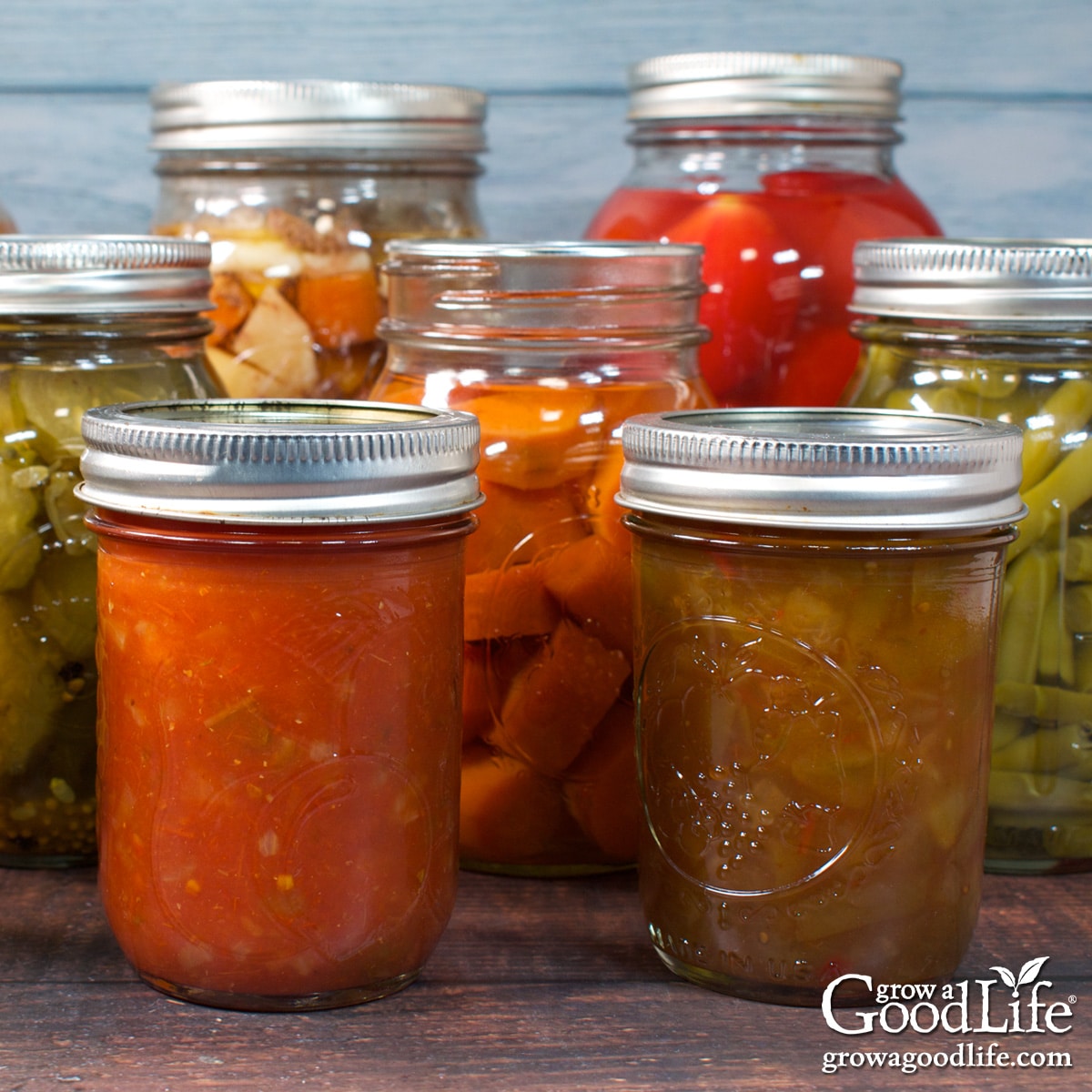 Jars of home canned food on a table.