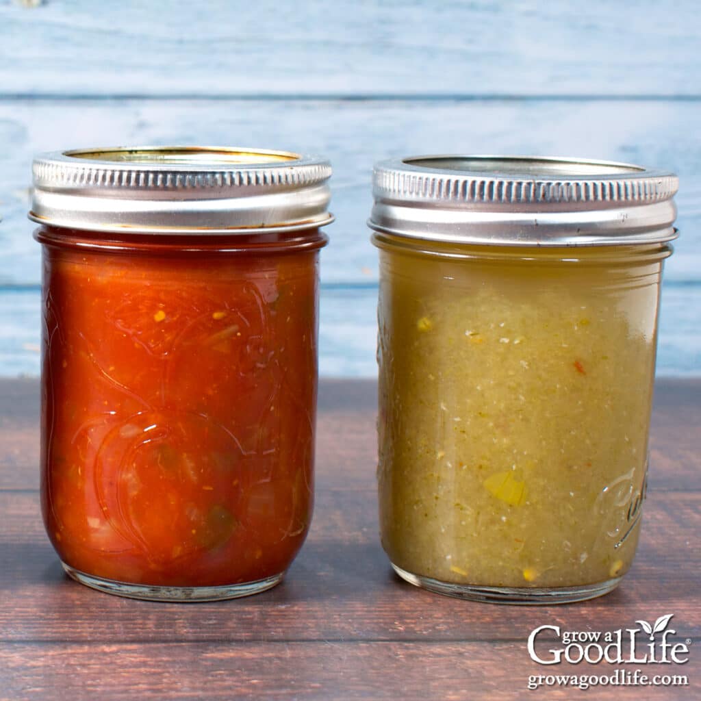 Jars of home canned salsa on a counter.