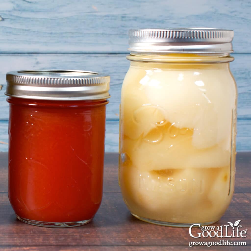 Jars of home canned pears and strawberry jelly.