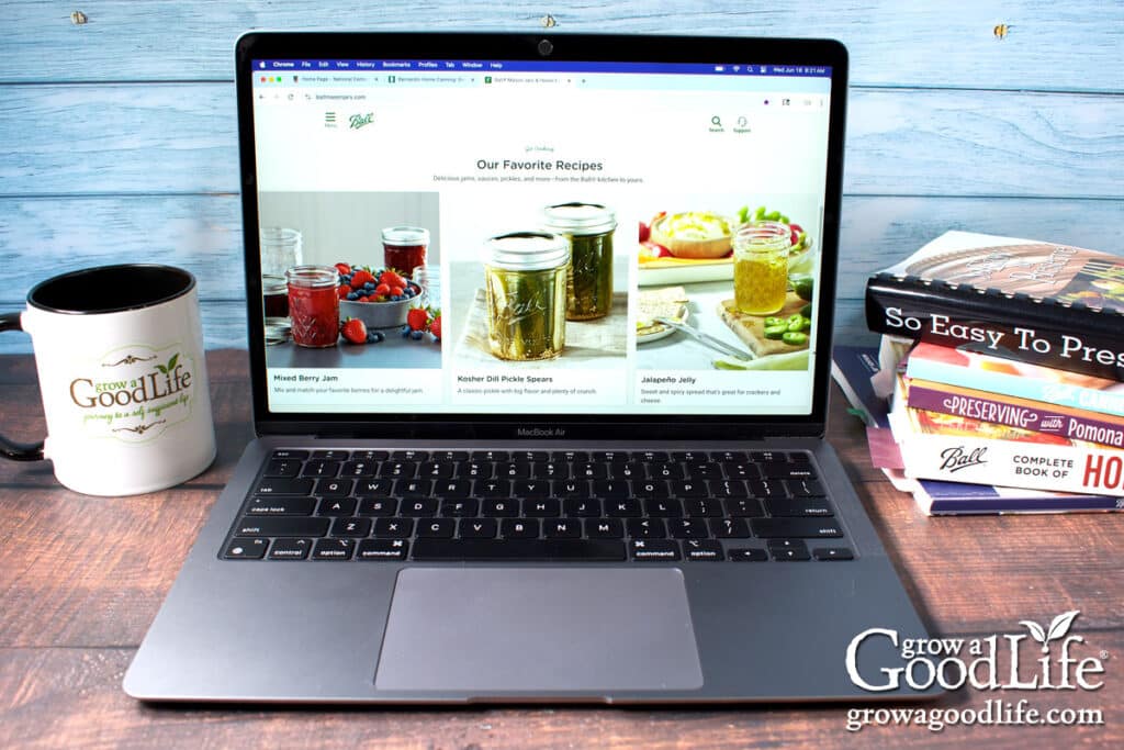 A macbook computer showing the ball canning website.