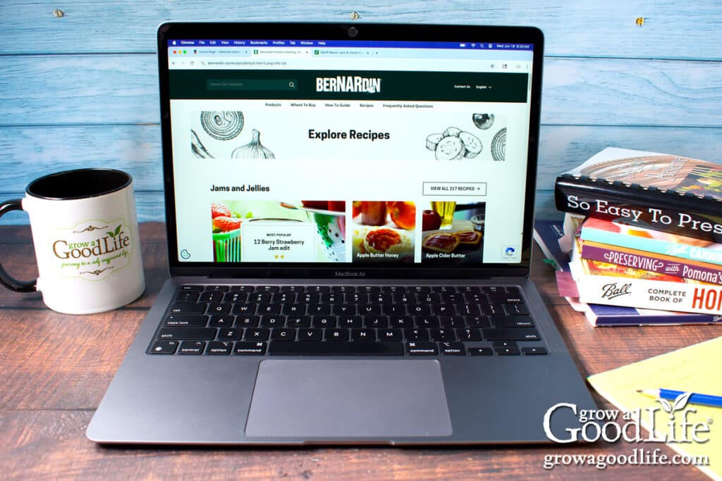A laptop on a table with the Bernardin canning website on the screen.