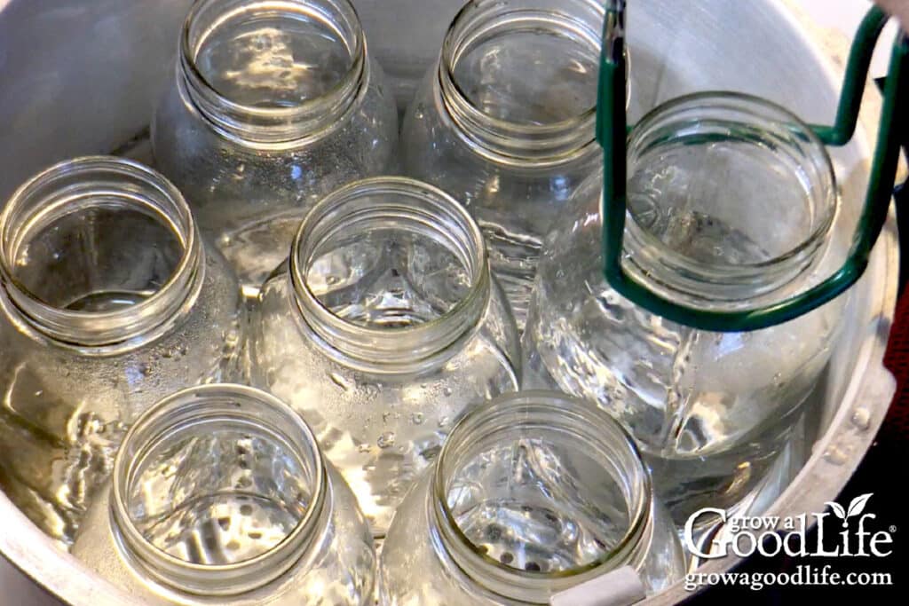 Removing a jar from the canner with the jar lifter.